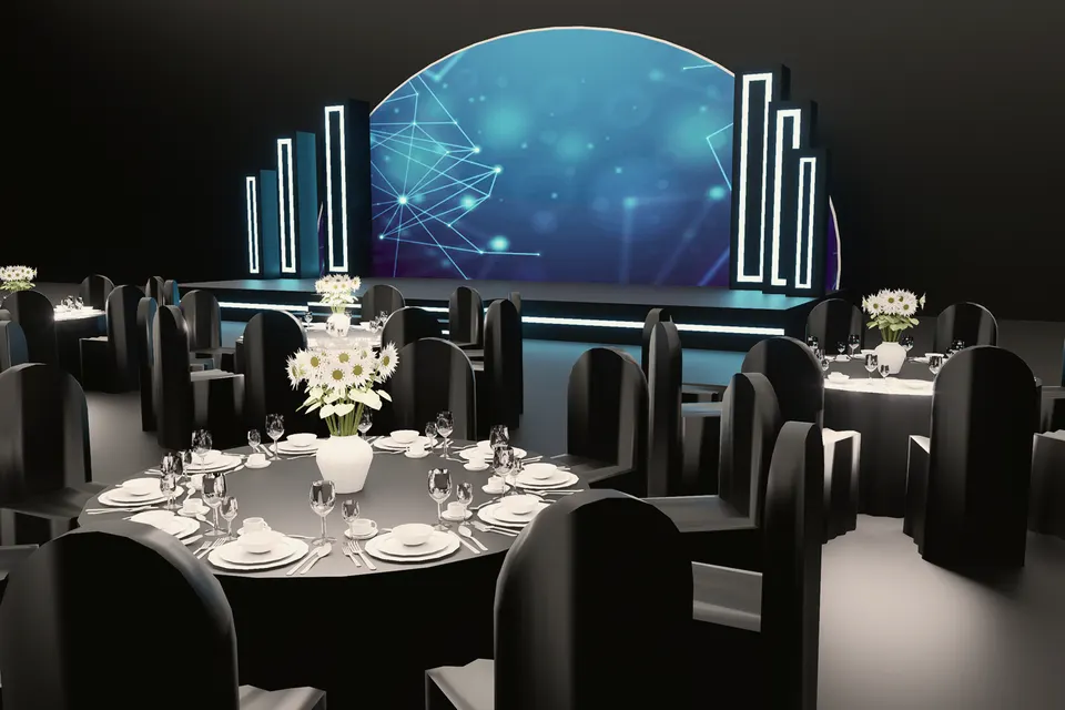 Banquet hall facing a curved corporate stage lit in cool blue