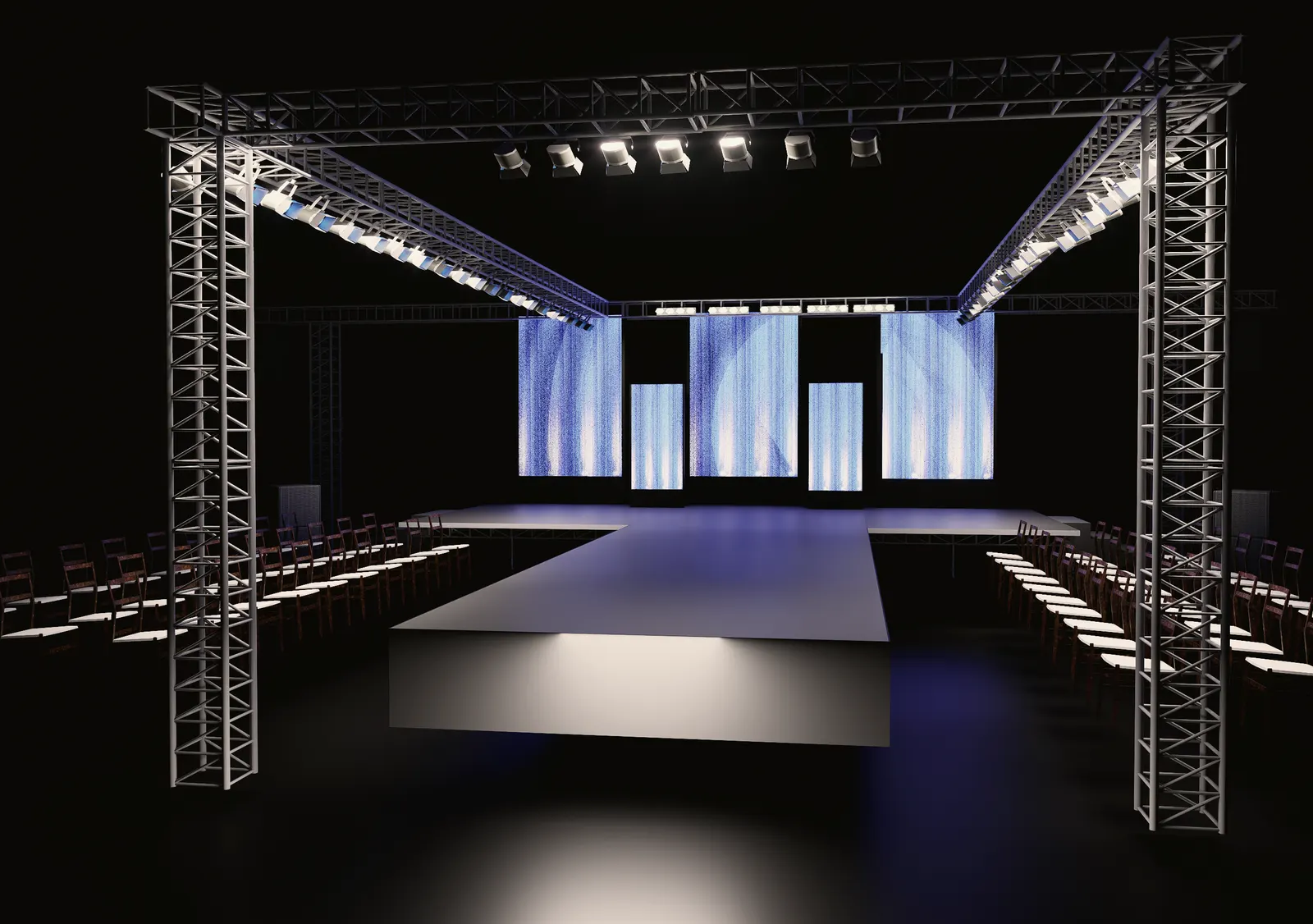 Truss-framed runway with LED panels and tiered seating